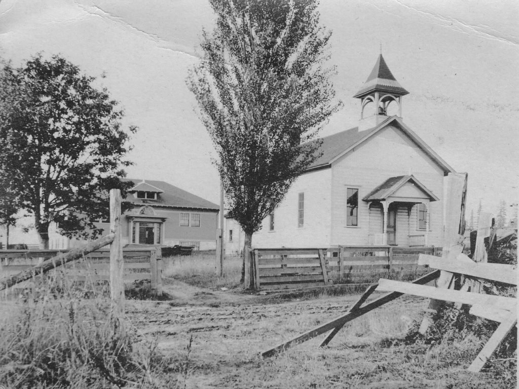 Photo of both the 1890 and 1910 Concord school buildings, with Concord Rd in the foreground